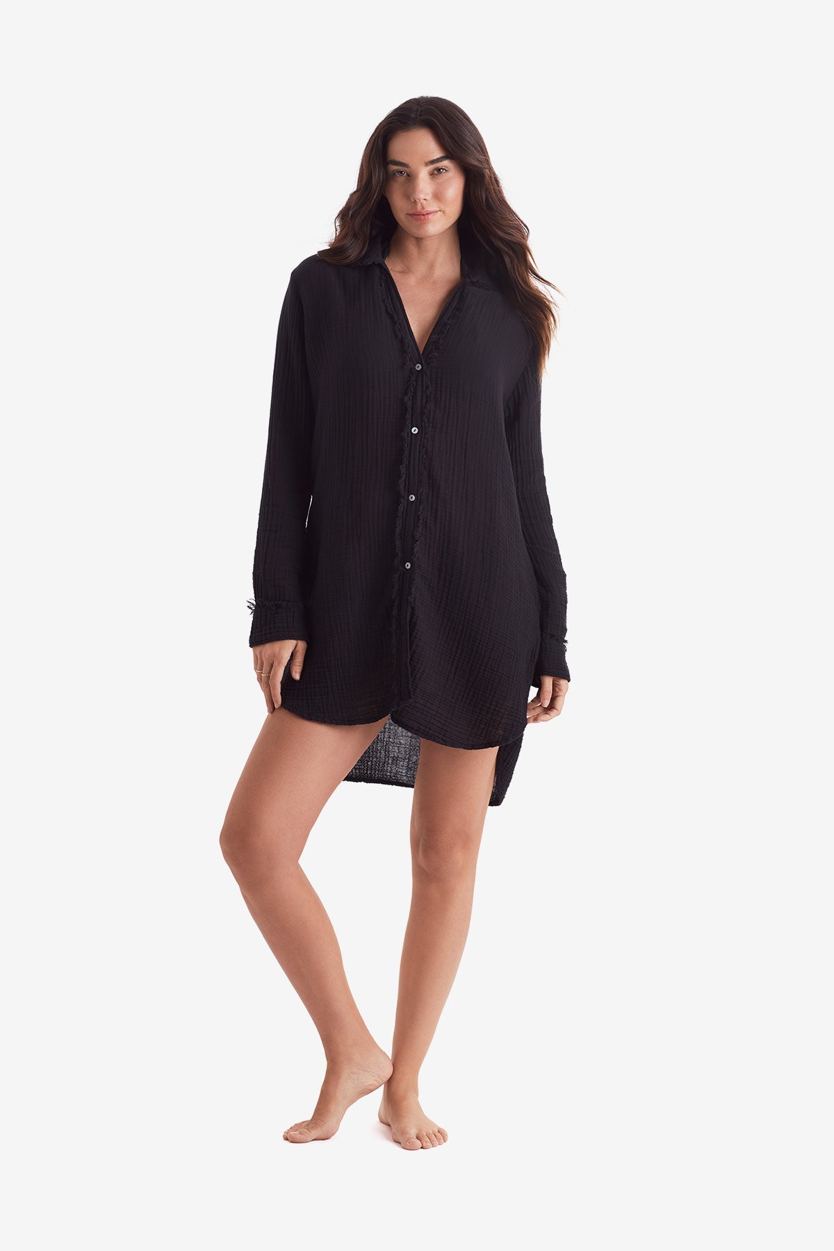 Woman wearing a black long sleeve button up shirt
